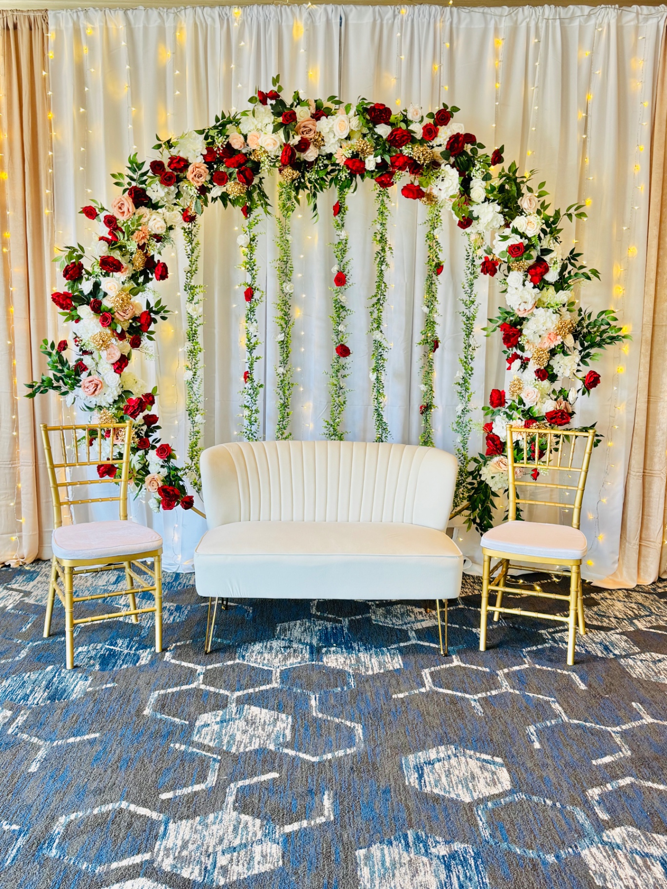 Red & white rose arch with loveseat