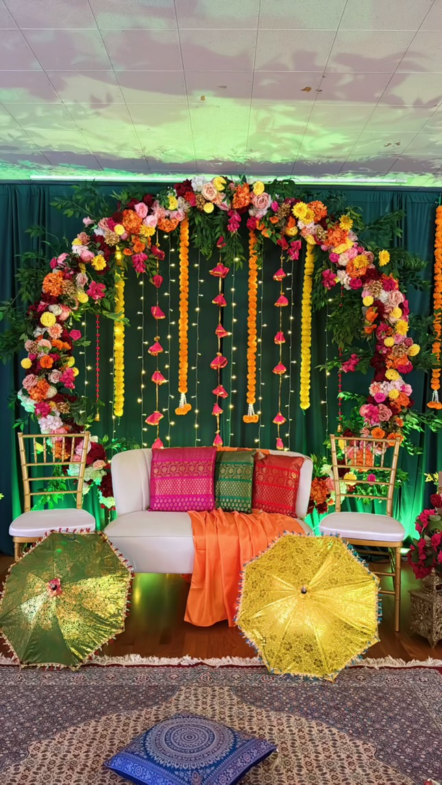 Emerald stage with full floral arch