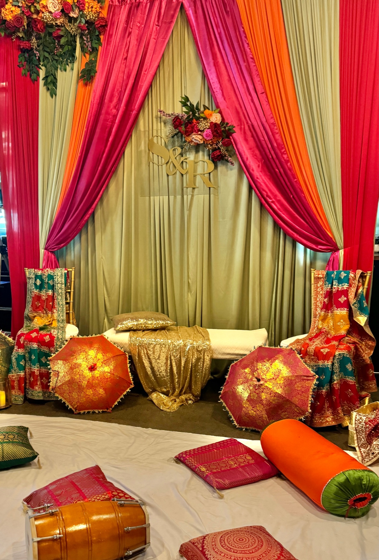 Pink & orange draped stage