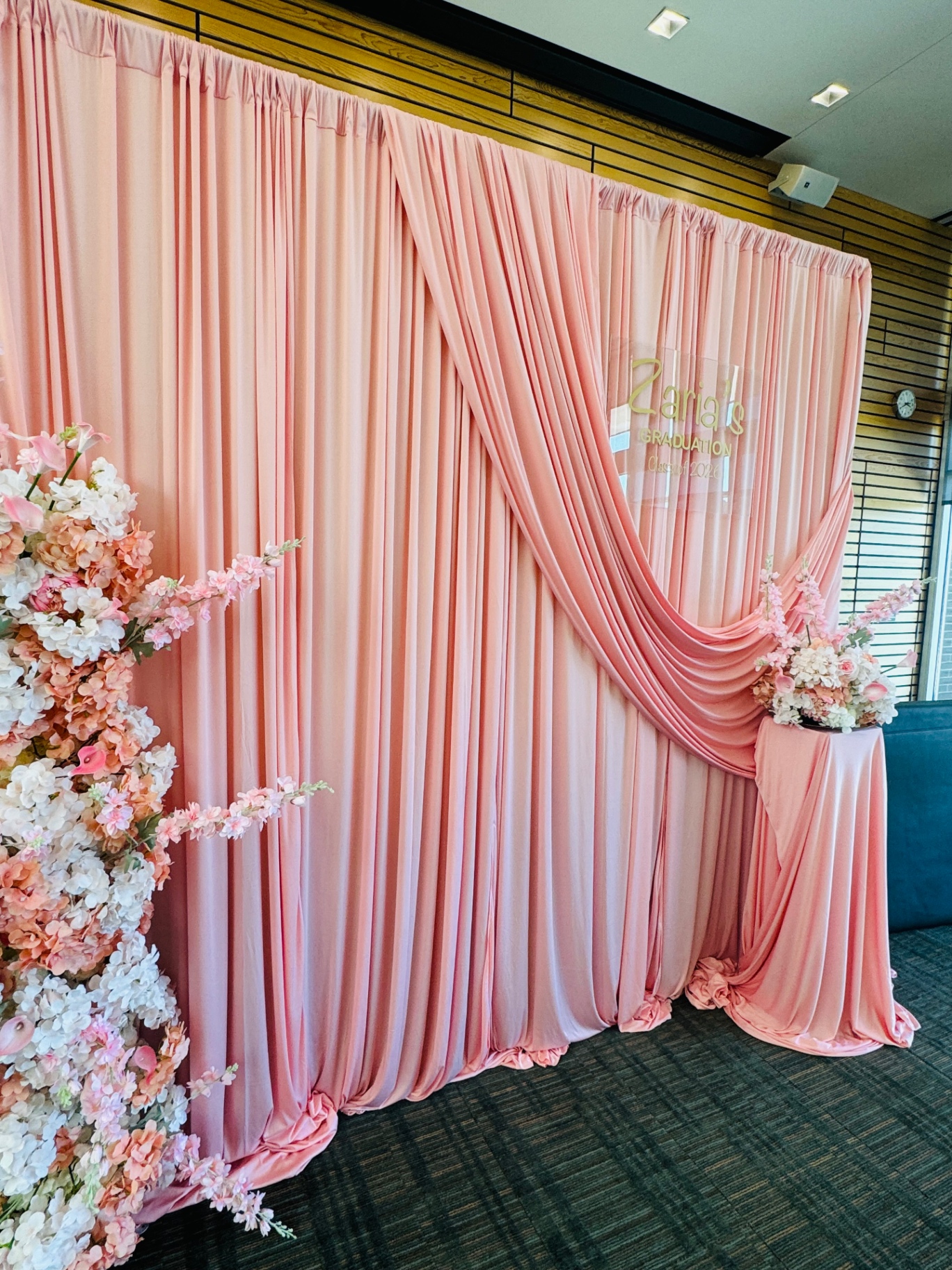 Blush pink draped backdrop