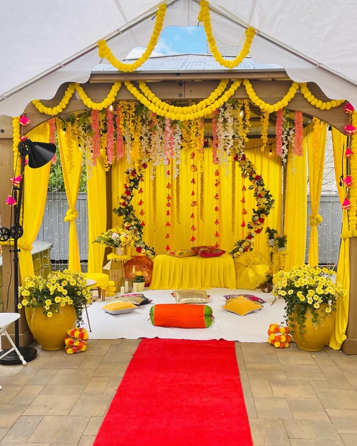 Yellow tent with marigold garlands